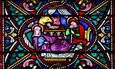 Stained glass (Nineteenth century) of Christmas Nativity Scene with Virgin Mary, Saint Joseph, and Jesus baby. .