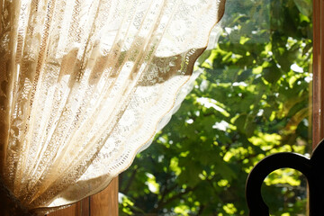 Blurred window and vintage tulle curtain background.