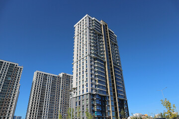 Naklejka premium Modern multi-storey high-rise buildings against the sky.