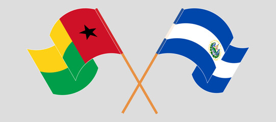 Crossed and waving flags of Guinea-Bissau and Republic of El Salvador. Vector illustration