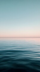 Fototapeta premium Serene ocean view with a calm horizon at dusk.