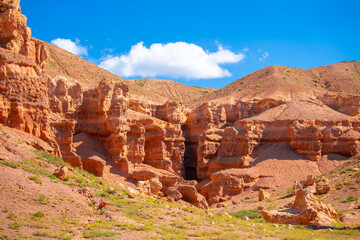 Fototapeta premium Charyn Canyon, Valley of Castles. The excellence of Kazakhstan. Panorama of natural unusual landscape. The red canyon of extraordinary beauty looks like a Martian landscape.