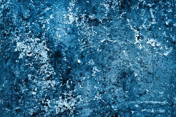 blue wall painted with white old peeling paint