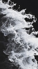 Abstract representation of swirling smoke against a dark background.