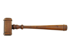 A wooden gavel used in legal settings to signify authority and order.