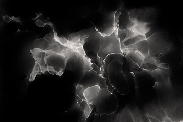 Macro close-up of abstract white and gray alcohol ink layers and splashes on black background. Fluid ink, full frame background in black and white. Art for design.