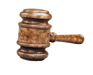 A wooden gavel used in legal proceedings, symbolizing authority and justice.