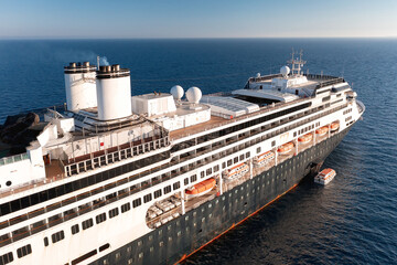 Large cruise ship sailing on the ocean on a sunny day