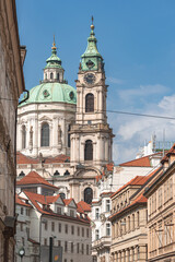 St. Nicholas church towering over the streets of Prague on a sunny day