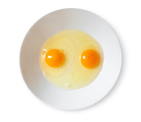 Two uncooked eggs on a plate on transparent background