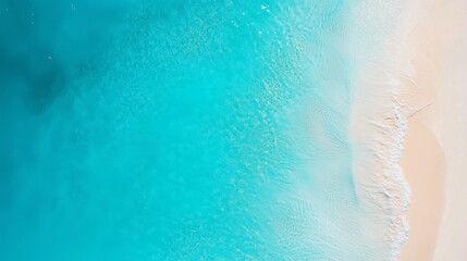 Blue marine water smooth wave with pink sand beach aerial view