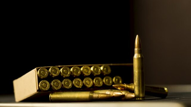 Displayed ammunition on a dark stage.
