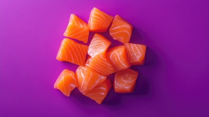 Top view of raw salmon cubes with a sashimi menu style, isolated against a vibrant purple background
