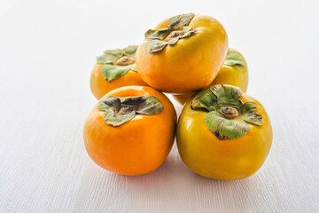 Korean persimmon pile on white background