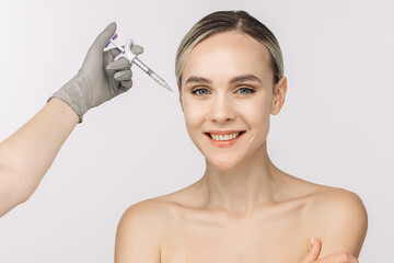 A woman confidently poses against a white background beside a syringe. This image captures the...