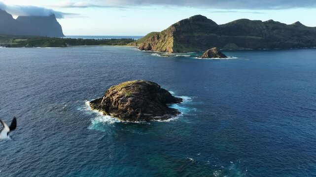 Aerial footage of Lord Howe island from North end looking down towards Kim's lookout and Mt Eliza and Noddy Island slow motion
