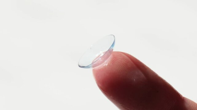 close-up, a contact lens on a woman&rsquo;s finger for vision correction. the concept of correcting myopia and hyperopia.