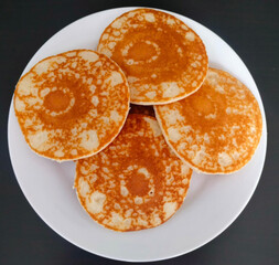 Pancakes in a white plate, Grey background