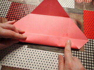 Origami jewelry box made of colored papers. Step 7 from 12