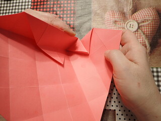 Origami jewelry box made of colored papers. Step 8 from 12
