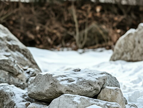 background for product photography for a brand. Stone to place your product in the foreground, snow-covered mountains, and forests of mountainous areas in winter behind it