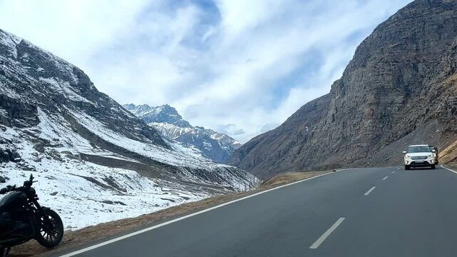 MANALI, INDIA - January 9, 2024: Atal Tunnel Indian highway tunnel built under the Rohtang Pass in Himalayas.Snow mountains landscape.Winter ride between snow mountains in Manali Himachal Pradesh.