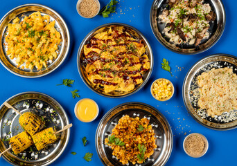 Loaded Cheese Fries, Grilled Chicken Macaroni Salad, Truffle Mac and Cheese, Grilled Corn kernel, Grilled Corn cob, Loaded Fries Nachos with Kimchi, Chicken, Cheese, Sauce, Mayonnaise dip top view