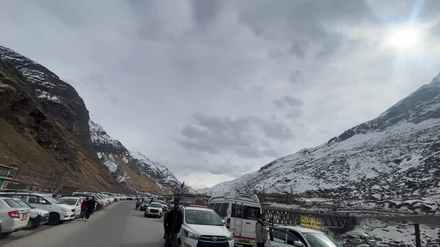 MANALI, INDIA - January 9, 2024: Atal Tunnel Indian highway tunnel built under the Rohtang Pass in Himalayas.Snow mountains landscape.Winter ride between snow mountains in Manali Himachal Pradesh.
