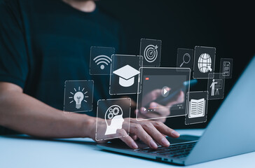 Online Education and E-Learning Concept. Person use laptop with icons representing online...