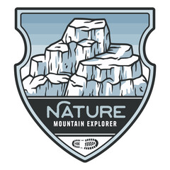 Vintage style emblem depicting a snowy mountain range, perfect for adventurers and nature enthusiasts venturing into the great outdoors
