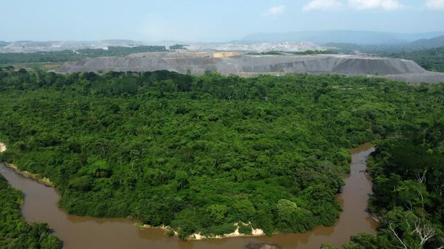 Huge open mine at the brink of the rainforest in Brazil