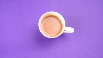 Top view of colorful working table have Headphones,mobile phone and cup of tea on color blue, Yellow and pink background for create idea for business or design. Relax time listen song (flat lay).