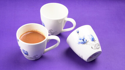 Top view of colorful working table have Headphones,mobile phone and cup of tea on color blue, Yellow and pink background for create idea for business or design. Relax time listen song (flat lay).