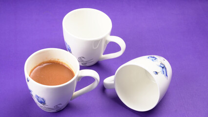 Top view of colorful working table have Headphones,mobile phone and cup of tea on color blue, Yellow and pink background for create idea for business or design. Relax time listen song (flat lay).