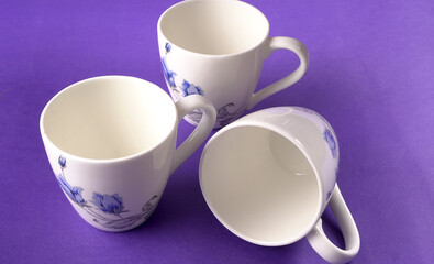 Top view of colorful working table have Headphones,mobile phone and cup of tea on color blue, Yellow and pink background for create idea for business or design. Relax time listen song (flat lay).