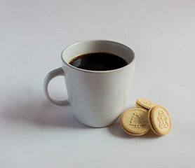 Cup of coffee with Round  Christmas cookies. Vanilla or butter sandwich cookies.