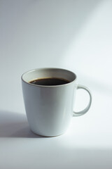 Cup of coffee on white  background. Close up.