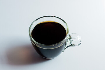 black drip coffee in glass cup  white background.