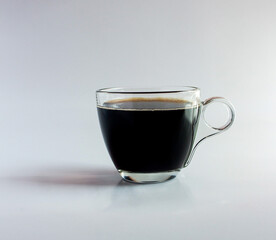 black drip coffee in glass cup  white background.