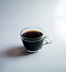 black drip coffee in glass cup  white background.