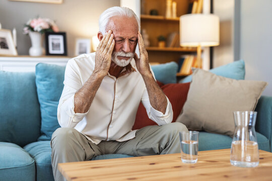Headache, senior man and stress in home for mistake, mental health and brain fog in retirement. Face, tired and frustrated elderly guy with migraine, crisis and pain of vertigo, trauma and fatigue.