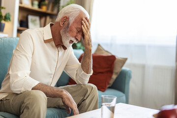 Headache, senior man and stress in home for mistake, mental health and brain fog in retirement....