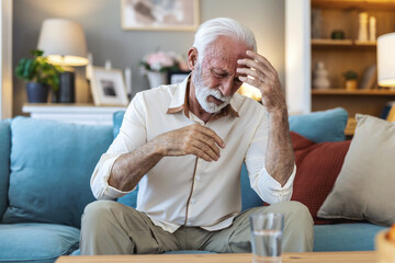 Senior man, headache and stress in retirement, anxiety and migraine at home, tension or pain....