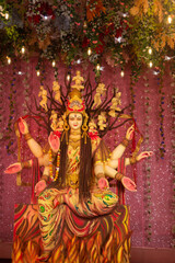 A beautiful idol of Maa Durga being worshipped at a pandal during Navratri. Navratri is biggest...