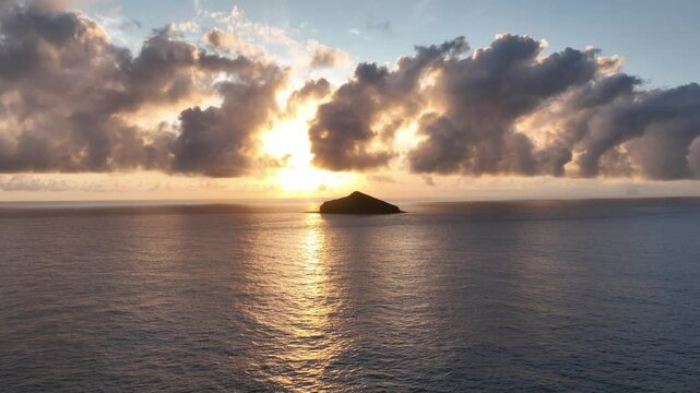 Aerial footage of Lord Howe island flying towards Mutton Bird Island at sunrise