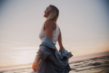 Creative Long Exposure Shot of Woman on Beach at Sunset © blackday