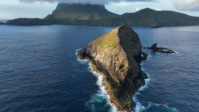 Aerial footage of Lord Howe island around Mutton Bird Island at sunrise