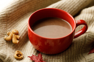 Hot chocolate drink in a red cup. Autumn Winter composition