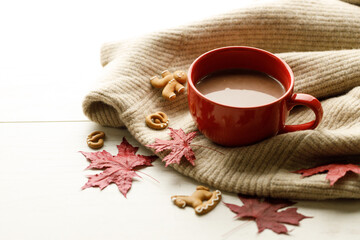 Hot chocolate drink in a red cup. Autumn Winter composition