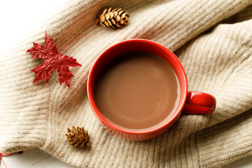 Hot chocolate drink in a red cup. Autumn Winter composition
